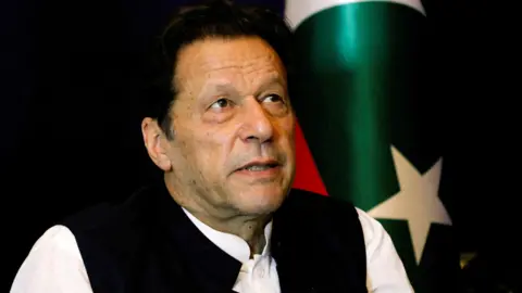 Reuters Mantan Perdana Menteri Pakistan Imran Khan berhenti sejenak saat berbicara dengan Reuters selama wawancara di Lahore, Pakistan.