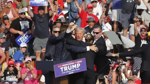 Trump menentang EPA beberapa saat setelah terkena peluru pada rapat umum bulan Juli