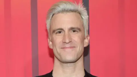 Getty Images Foto kepala Gavin Creel - dia memiliki rambut pendek campuran pemutih dan mata coklat