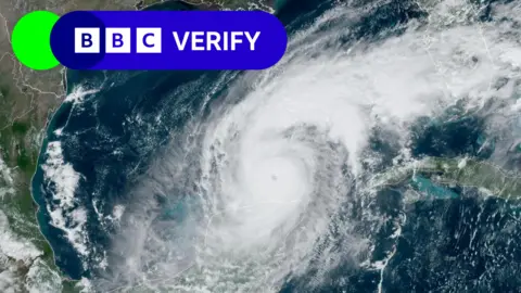 Citra satelit Reuters/NOAA dari Badai Milton di atas lautan, label Verifikasi BBC di sudut kiri atas.